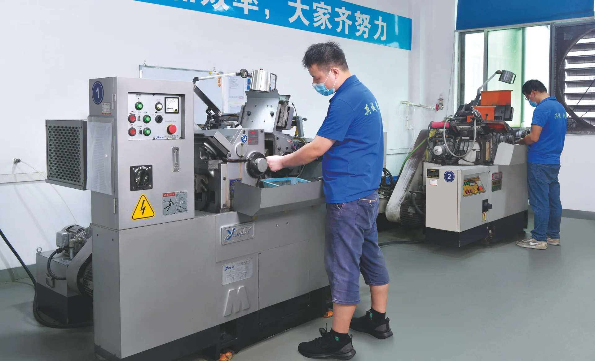 Two SENLAN operators working at precision grinding machines