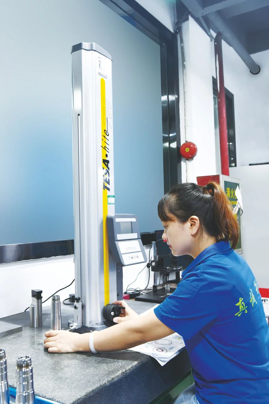 Inspector using a height gauge to measure a mold component