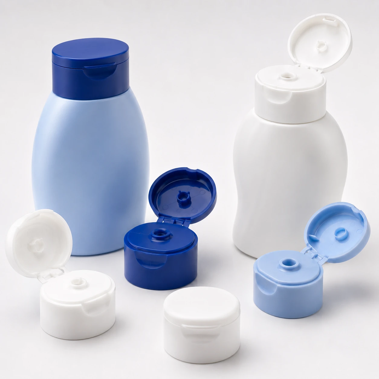 Illustrative blue and white dispensing closures and bottles