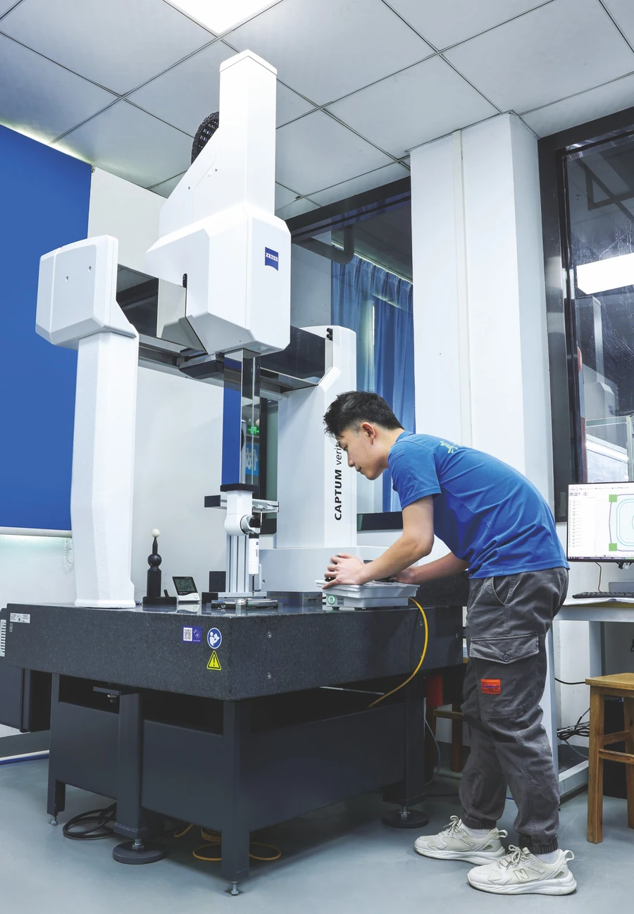 Technician operating coordinate inspection equipment