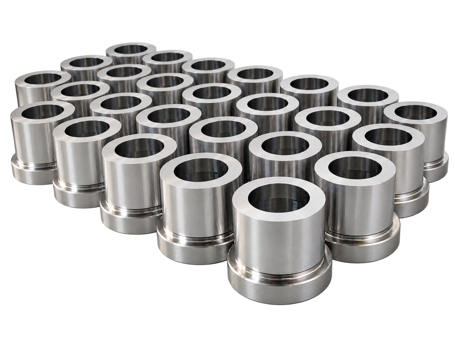 A group of sleeve components with bores and stepped outside profiles.
