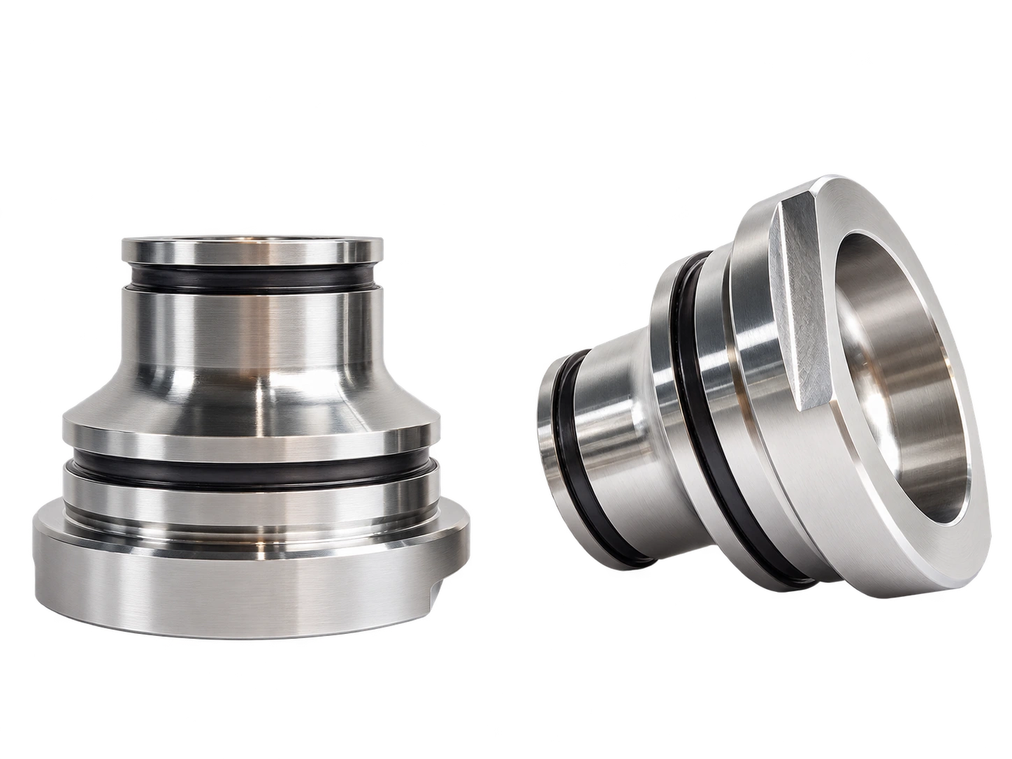 Short metal components with shoulders, flanges and central bores.